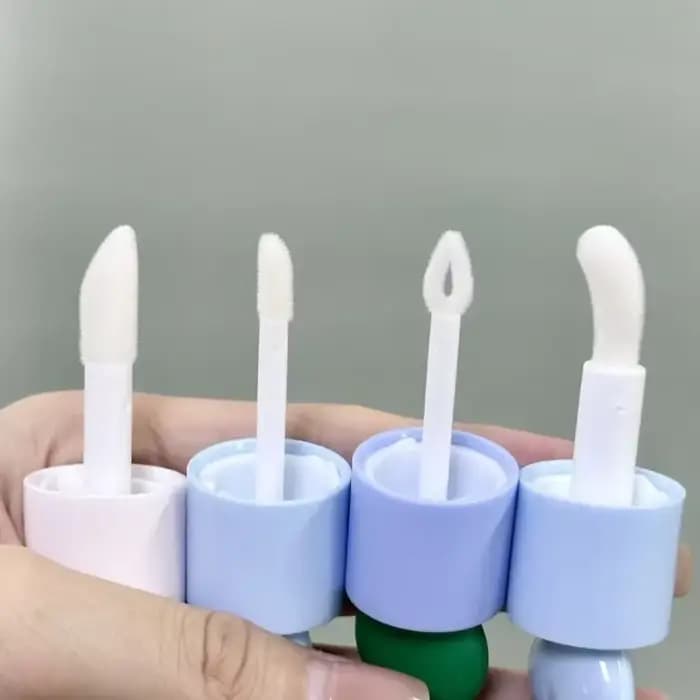 Récipient à brillant à lèvres en forme de boule supérieure transparente