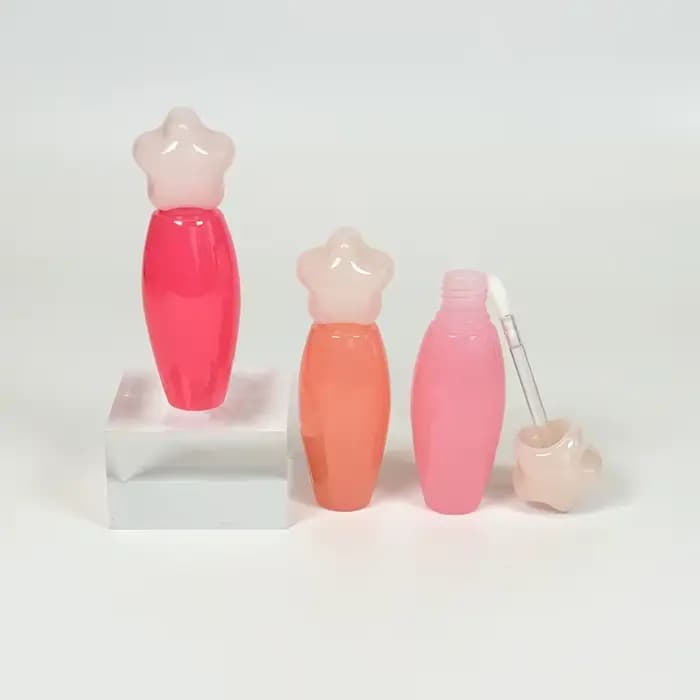 Tube à gloss transparent en forme d'étoile avec grande brosse