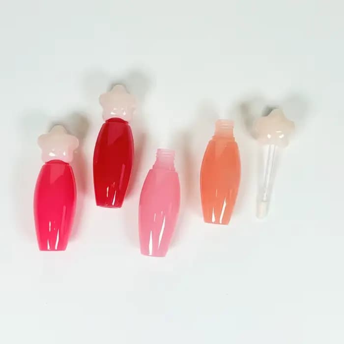 Tube à gloss transparent en forme d'étoile avec grande brosse