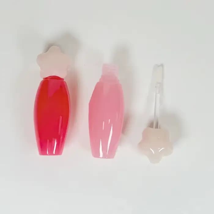 Tube à gloss transparent en forme d'étoile avec grande brosse