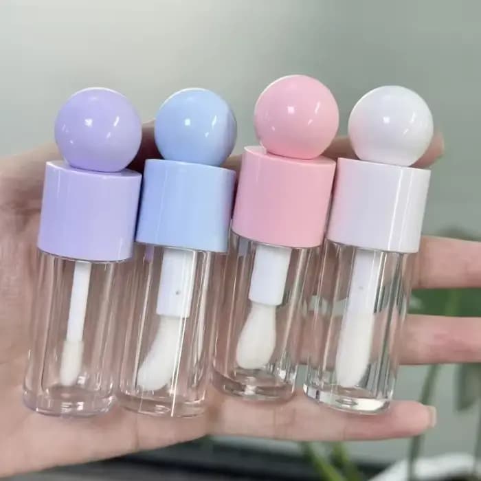 Récipient à brillant à lèvres en forme de boule supérieure transparente