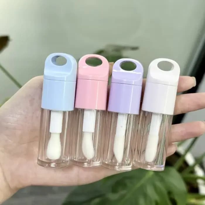 Récipient à brillant à lèvres en forme de boule supérieure transparente