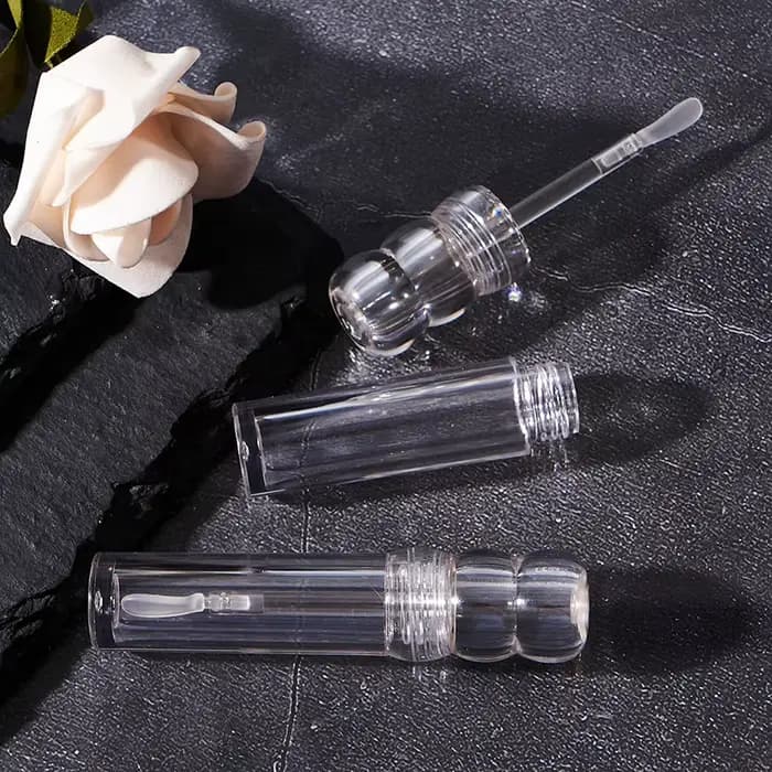 Tube de brillant à lèvres cosmétique rond